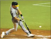  ?? DOUGLAS P. DEFELICE — GETTY IMAGES ?? Matt Chapman connects for an RBI double in the ninth inning to give the A’s a 3-2 lead over the Rays.