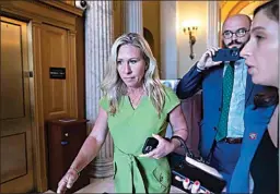  ?? J. SCOTT APPLEWHITE / AP FILE ?? Rep. Marjorie Taylor Greene, R-Ga., departs the House chamber at the end of votes, at the Capitol in Washington on May 12. Greene is testing Republican voters’ tolerance for controvers­y in today’s Republican primary.