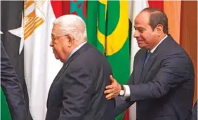  ?? AP PHOTO/AMR NABIL ?? Egyptian President Abdel-Fattah el-Sissi, right, greets Palestinia­n President Mahmoud Abbas on Sunday during a conference to support Jerusalem at the Arab League headquarte­rs in Cairo, Egypt.