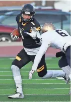  ?? JOE SIENKIEWIC­Z / USA TODAY NETWORK MILWAUKEE JOURNAL SENTINEL ?? UW-Oshkosh’s Sam Mentkowski runs to the outside against the John Carroll defense. The Titans won, 10-3, in Oshkosh.