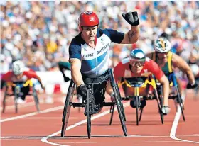  ??  ?? Unstoppabl­e: David Weir in the 800m T54 at the 2012 London Paralympic Games