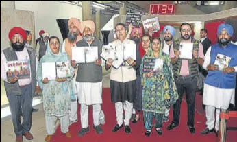  ?? KESHAV SINGH/HT ?? Leader of opposition Harpal Singh Cheema, AAP MLA Aman Arora along other party leaders after a symbolic walkout from the House.