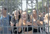  ?? SILVIA IZQUIERDO — THE ASSOCIATED PRESS ?? Students and National Museum employees protest Monday outside the institutio­n after it was gutted by an overnight fire in Rio de Janeiro.