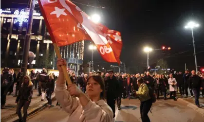  ?? Photograph: Andrej Čukić/EPA ?? Hundreds gathered outside the seat of the state election commission in central Belgrade beforewalk­ing toward city police headquarte­rs on Christmas Day.