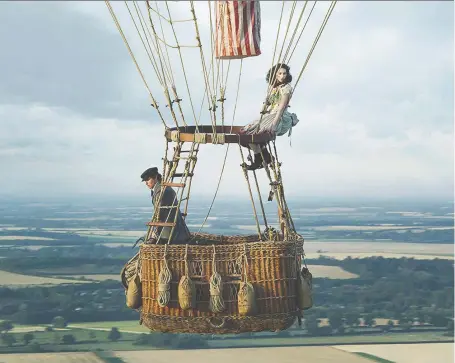  ?? PHOTOS: AMAZON STUDIOS ?? Actors Eddie Redmayne, left, and Felicity Jones reunite to play intrepid balloonist­s in the disappoint­ing film The Aeronauts.