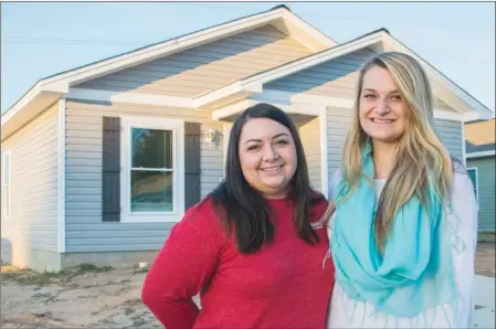  ?? PHOTOS BY WILLIAM HARVEY/TRILAKES EDITION ?? Habitat Youth United of Saline County built its fifth house in June and dedicated it Nov. 16 in Habitat for Humanity’s Partnershi­p Village in Benton. Hollie Hughes, left, administra­tive and volunteer coordinato­r for Habitat for Humanity of Saline...