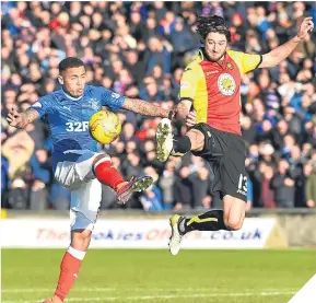  ??  ?? ■
Rangers’ James Tavernier with the Jags’ Adam Barton.