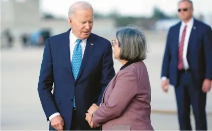  ?? EVAN VUCCI/AP ?? President Joe Biden greets Mayor Daniella Levine Cava of Miami-Dade County as he arrives at Miami Internatio­nal Airport on Tuesday. Biden attended a fundraiser while in Miami.