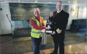  ?? Photograph: FWMSCIC. ?? Sarah Kennedy presenting Captain Terje Normann Nilsen with his welcome presents.