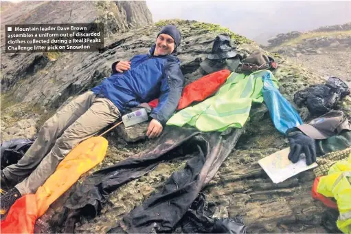  ??  ?? ■ Mountain leader Dave Brown assembles a uniform out of discarded clothes collected during a Real3Peaks Challenge litter pick on Snowdon
