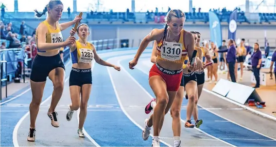  ?? ?? On the charge Chloe Watt hands the baton over to Zosia Paddon in the final