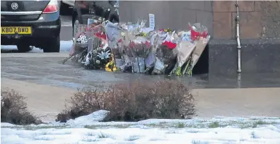  ??  ?? TRIBUTES: Flowers left at the Nicolson Institute following the death of pupil Anton Michael