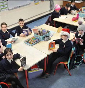 ??  ?? Ms. Starkie’s class reading books in St. Mary’s National School, Knockbridg­e.