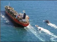  ?? ASSOCIATED PRESS ?? In this Jan. 4 file photo released by Tasnim News Agency, a seized South Korean-flagged tanker is escorted by Iranian Revolution­ary Guard boats on the Persian Gulf.