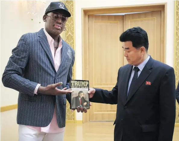  ?? — PHOTOS:AP FILES ?? Former NBA basketball star Dennis Rodman presents a copy of Donald Trump’s The Art of the Deal to North Korea’s Sports Minister Kim Il Guk earlier this month. Friends say Rodman really believes he is making a difference in U.S.-North Korea relations.