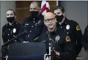  ?? LYNDA M. GONZÁLEZ — THE DALLAS MORNING NEWS ?? Chief Eddie Garcia, center, speaks during a press conference at the Dallas Police Department headquarte­rs on Thursday regarding the arrest and capital murder charges against Officer Bryan Riser.