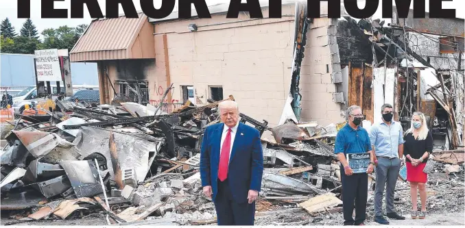  ?? Pictures: AFP ?? President Donald Trump tours an area affected by civil unrest in Kenosha, Wisconsin, on Tuesday, local time. Below left: A Black Lives Matter protester, left, brawls with a Trump supporter. Below right: National Guard troops move in.