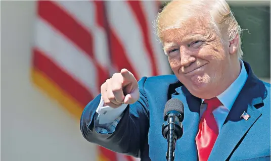  ??  ?? After the storm? A relaxed-looking Donald Trump during a National Day of Prayer at the White House yesterday. The payment disclosure appears to have been made to put him out of legal danger