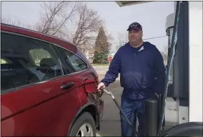  ?? JORDANA JOY — THE MORNING JOURNAL ?? Gary Luman, owner of Gary’s Marathon, fills a tank up at his gas station at 2312Garfie­ld Blvd. in Lorain. His business has taken a hit since the coronaviru­s outbreak and stay-athome order over the past few weeks.