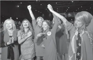  ?? ASSOCIATED PRESS ?? Members of the Trumpettes celebrate as incumbent U.S. Sen. Ted Cruz, R-Texas, is announced as the winner over Democratic challenger Rep. Beto O'Rourke in a tightly contested race at the Dallas County Republican Party election night watch party at The Statler Hotel in Dallas.