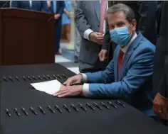  ?? Special-Georgia Governor’s Office ?? Gov. Brian Kemp signs the hate crimes bill into law Friday.