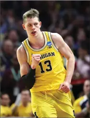  ?? Ezra Shaw / Getty Images ?? Michigan’s 6-11 forward Mo Wagner leads the team in scoring and rebounding.