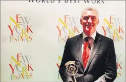  ??  ?? Tim Collins, CEO Ocean FM with the New York Festivals award for the station's production, Francisco