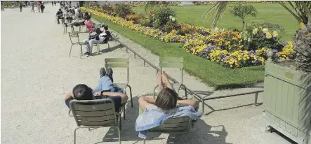  ?? RICK STEVES ?? Put your weary feet up in Luxembourg Garden, a picturesqu­e place to recharge in Paris.