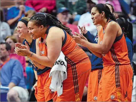  ?? SEAN D. ELLIOT/THE DAY ?? The Connecticu­t bench, from left, Rachel Banham, Danielle Adams and Brionna Jones, cheer from the sideline during a game against the New York Liberty on June 14 at Mohegan Sun Arena. Coach Curt Miller said team chemistry, including players on the...