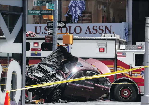  ?? SETH WENIG / THE ASSOCIATED PRESS ?? A smashed car rests after an allegedly intoxicate­d man plowed through pedestrian­s in New York City, killing one person and injuring 22.