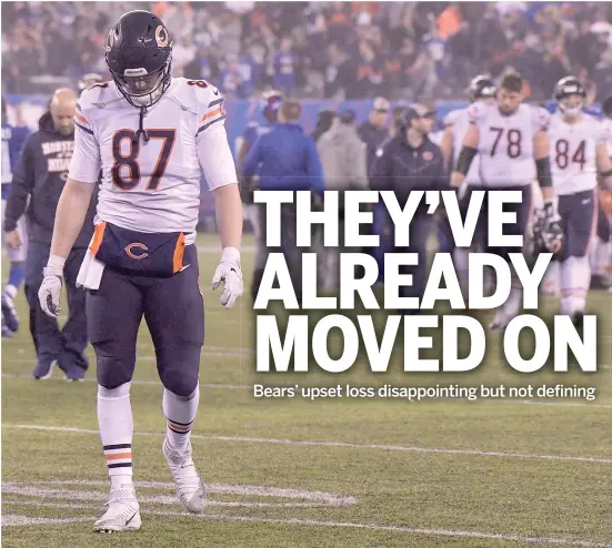  ?? BILL KOSTROUN/AP ?? Tight end Adam Shaheen dejectedly leaves the field after the Bears’ overtime loss Sunday to the Giants in East Rutherford, N.J.