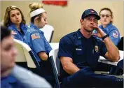  ??  ?? Josh Bryan of the Carrollton Fire Department attends a session Wednesday on how to avoid PTSD and burnout with a group of prospectiv­e medics at Faithful Guardian Training Center in Temple.