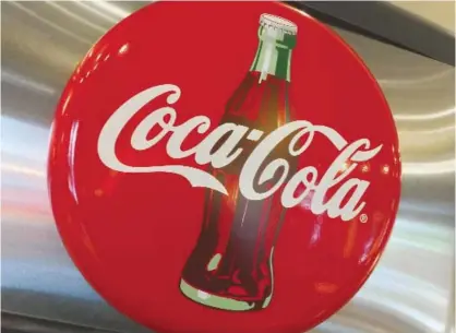  ??  ?? WASHINGTON, DISTRICT OF COLUMBIA: This file photo taken on May 1, 2016 shows a Coca-Cola logo in a restaurant.—AFP