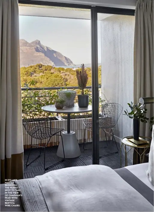  ??  ?? in dylan’s master bedroom, the perfect spot to take in the view of chapman’s peak with vintage bertoia wire chairs