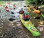  ?? PHOTOS BY JOHN STRICKLER — DIGITAL FIRST MEDIA ?? After a lunch break lunch break at the Mouns Jones property in Amity Township, kayakers participat­ing in this year’s Schuylkill River Sojourn arrive at Riverfront Park in Pottstown last week.