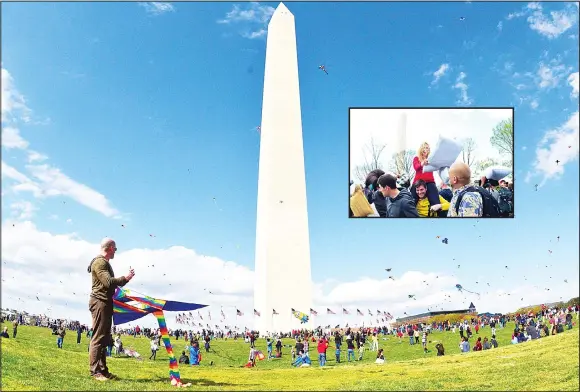  ??  ?? A man packs up his kite on the Mall near the Washington Monument in Washington, DC, during the annual Blossom Kite Festival on April 2. (Inset): People battle it out during the Internatio­nal Pillow Fight
Day on the National Mall in Washington, DC,...