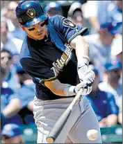  ?? AP/NAM Y. HUH ?? Milwaukee’s Hernan Perez hits an RBI single against the Chicago Cubs on Thursday in Chicago.