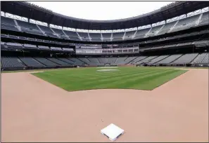  ?? (AP/Elaine Thompson) ?? T-Mobile Park in Seattle sits vacant as the Major League Baseball season has been delayed because of the coronaviru­s pandemic. Major League Baseball officials contend they are going to lose approximat­ely $640,000 per game over an 82-game schedule that is played without paying spectators.