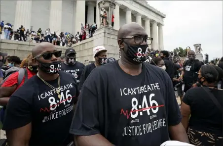  ?? Alex Brandon/Associated Press ?? Philonise Floyd, right, brother of George Floyd, gets ready to march from the Lincoln Memorial to the Martin Luther King Jr. Memorial during the March on Washington on Friday.