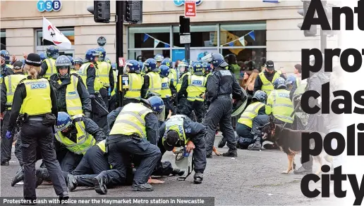  ??  ?? Protesters clash with police near the Haymarket Metro station in Newcastle