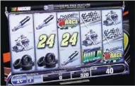  ??  ?? Bally Technologi­es is rolling out its NASCAR slot machines throughout the U.S. starting this week. The games were unveiled in the fall at the Global Gaming Expo in Las Vegas.