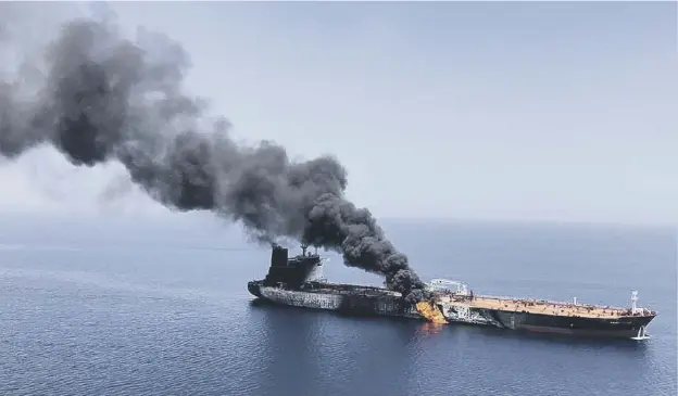  ??  ?? An oil tanker burns near the strategic Strait of Hormuz yesterday in the wake of attacks which forced sailors to evacuate
PICTURE; AP