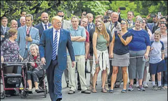  ?? NYT ?? President Trump walks over toward reporters before boarding Marine One at the White House.