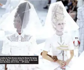  ??  ?? Models present creation by Thom Browne during the Women°Øs SpringSumm­er 2020 Ready-to-Wear collection fashion show at the Ecole nationale superieure des Beaux-Arts in Paris. — AFP photos