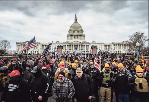  ?? Jon Cherry/Getty Images / TNS ?? A pro-Trump mob gathers in front of the U.S. Capitol Building on Jan. 6 in Washington, D.C.