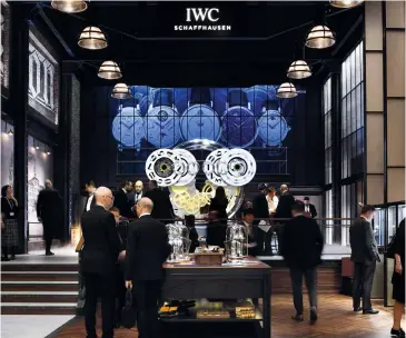  ??  ?? IWC’s booth at the SIHH Opposite page SIHH’s ambiance; CEOs of the watch maisons