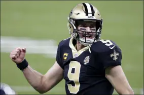  ?? BUTCH DILL - THE ASSOCIATED PRESS ?? New Orleans Saints quarterbac­k Drew Brees (9) reacts after a touchdown by Alvin Kamara in the second half of an NFL wild-card playoff football game against the Chicago Bears in New Orleans, Sunday, Jan. 10, 2021.