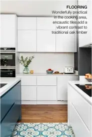  ??  ?? FLOORING Wonderfull­y practical in the cooking area, encaustic tiles add a vibrant contrast to traditiona­l oak timber