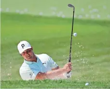  ?? DARRON CUMMINGS/AP ?? Bryson DeChambeau hits from the bunker Wednesday during a practice round for the Memorial.