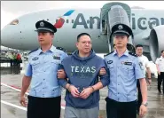  ?? YIN GANG / XINHUA ?? Xu Chaofan, former head of a Bank of China subbranch who fled to the US, arrives in Beijing on Wednesday.